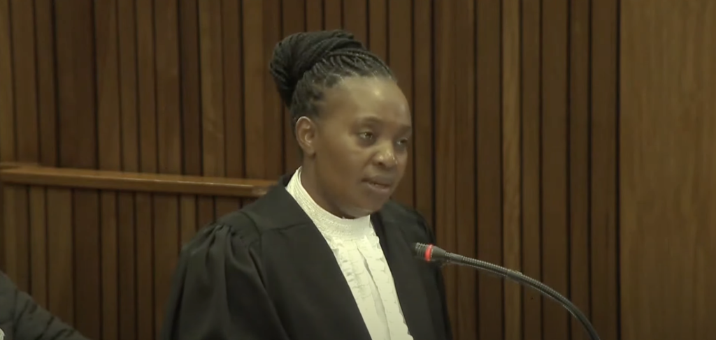 Kelly Khumalo’s mother, picked up a hat on the kitchen floor after Meyiwa was shot