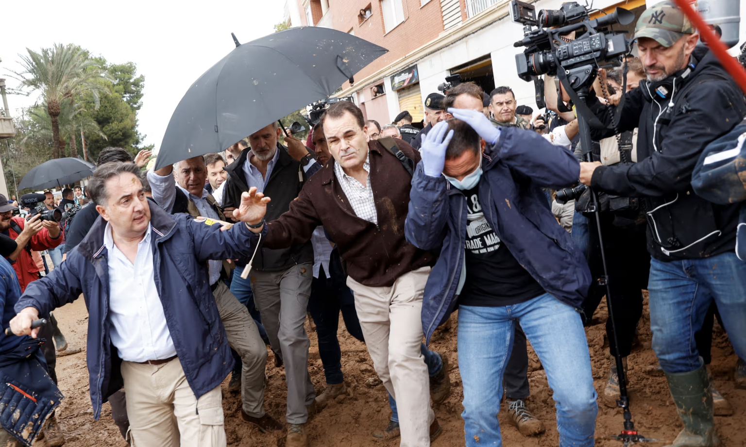 Residents throw mud and insults at Spanish king on visit to flood-hit town