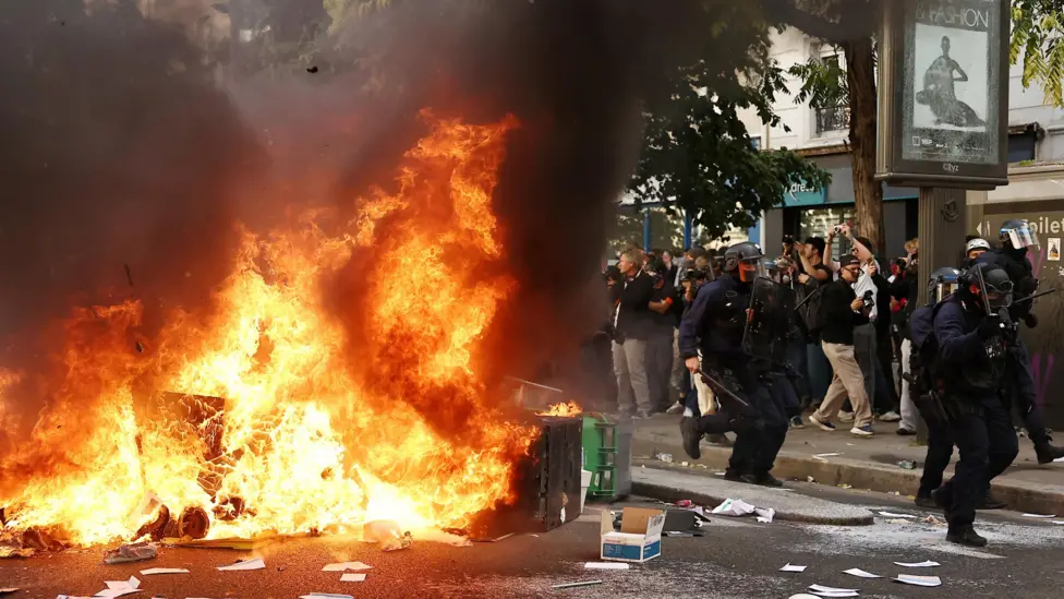 France suspends stun grenades after student loses hand during high school protests